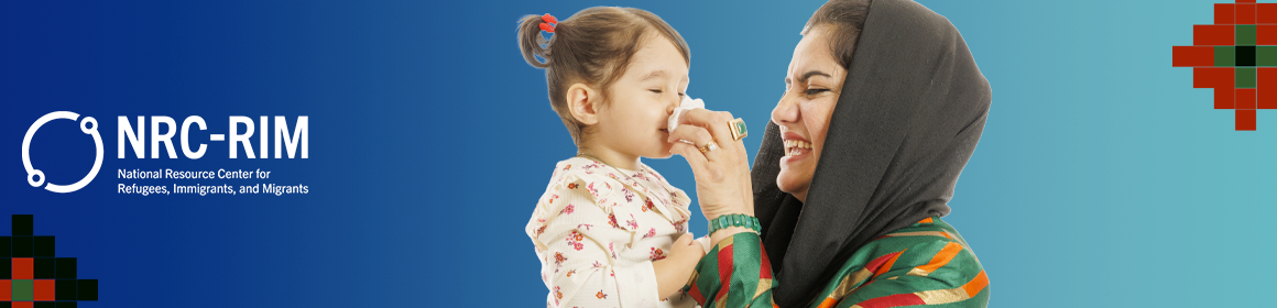 Afghan woman wiping daughter's nose