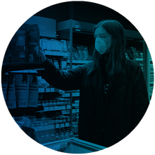 Woman shopping at pharmacy wearing face mask