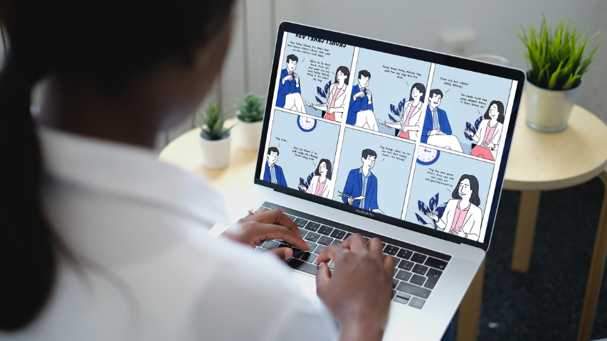 Youth editing comics on laptop